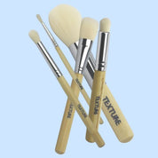 Professional makeup artist tools including palettes brushes airbrush equipment and kit essentials